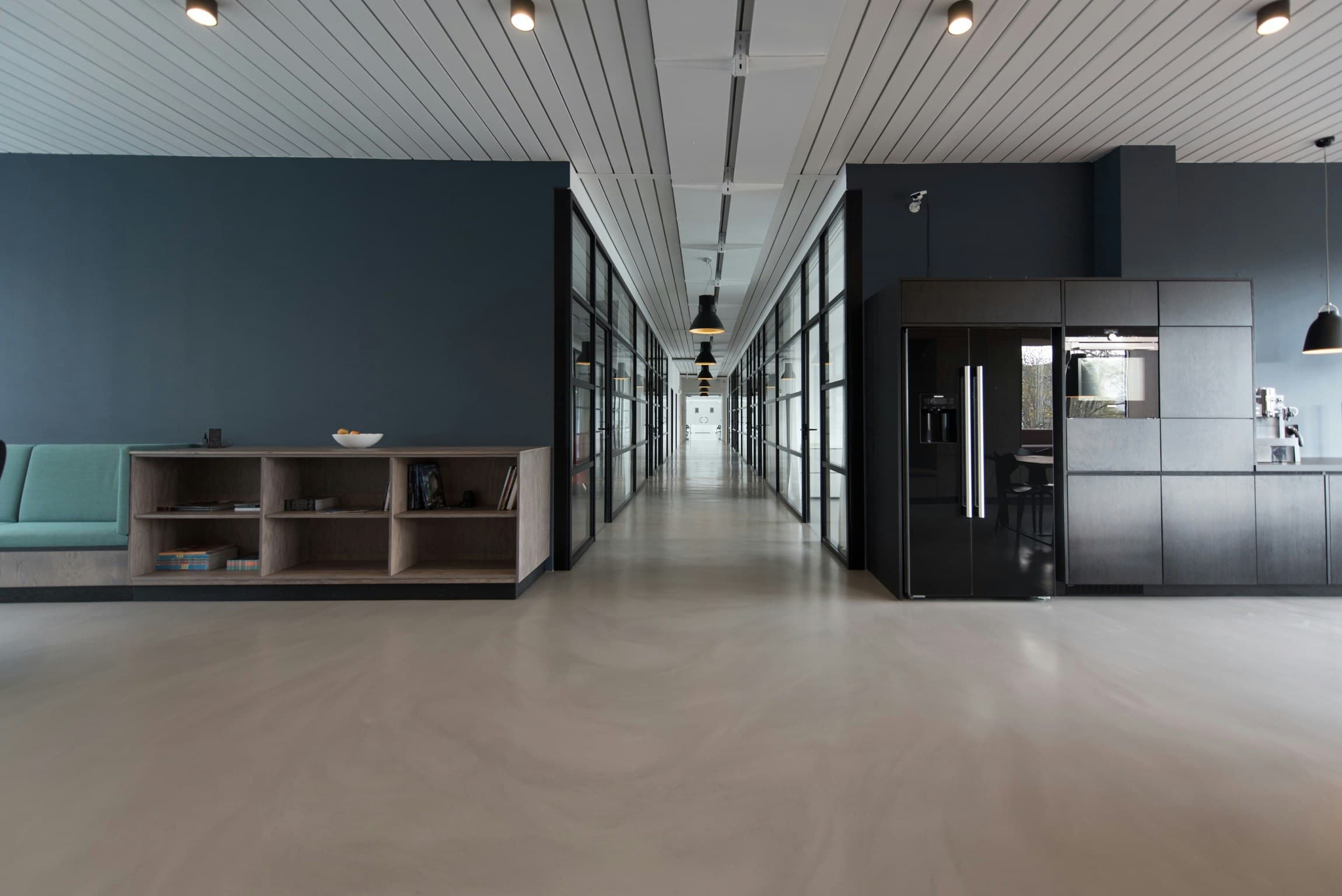 Bright contemporary commercial interior with glazed meeting rooms